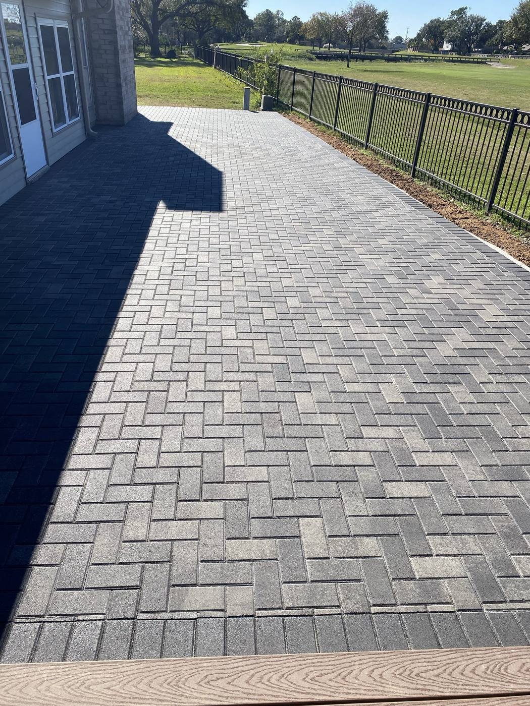 Herringbone-pattern Holland paver walkway and patio